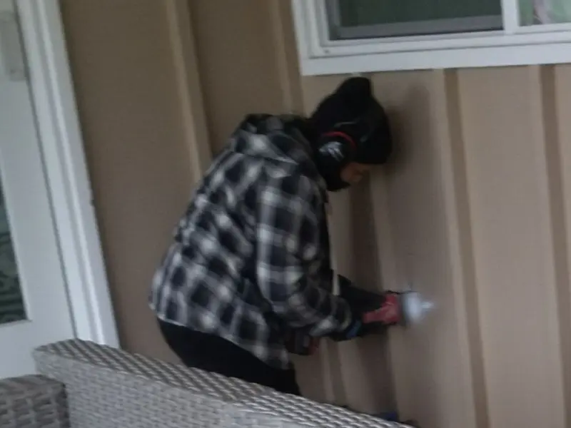 Professional electrician installing an exterior outlet in Floyds Knobs