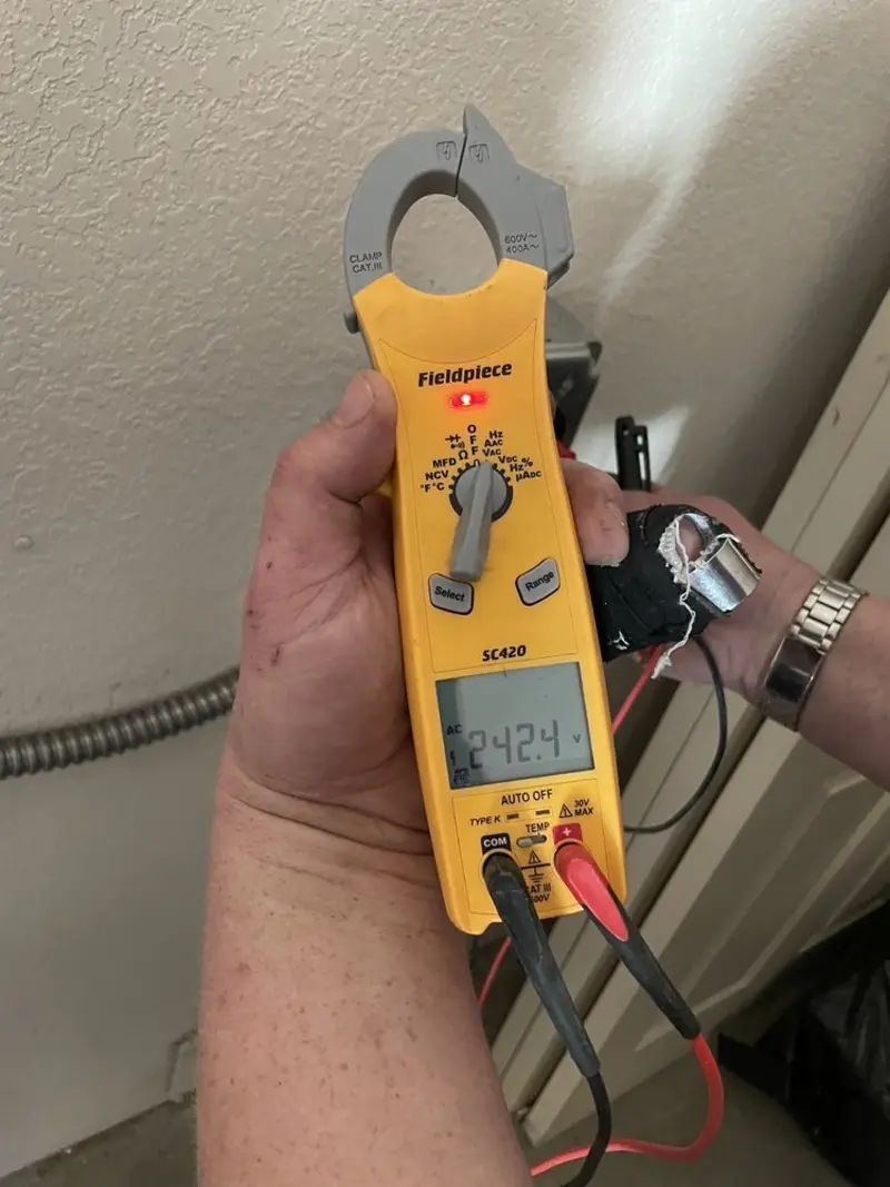 Voltage testing with clamp meter during Recessed Lighting Installation in Floyds Knobs